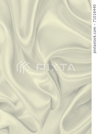 Smooth elegant golden silk or satin luxury cloth texture as wedding background. Luxurious background design. In Sepia toned. Retro style Smooth elegant golden silk or satin luxury cloth texture as wedding background. Luxurious background design. In Sepia toned. Retro style 71016440