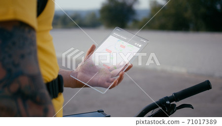 Senior male choosing movie on futuristic TV Senior male choosing movie on futuristic TV 71017389