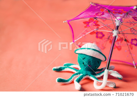 Crochet octopus doll isolated on yellow background Crochet octopus doll isolated on yellow background 71021670