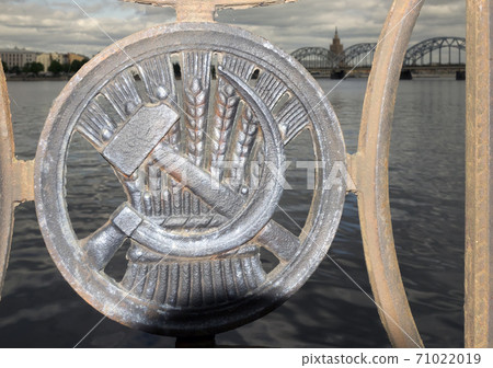Soviet sickle and hammer ornament on Railway Bridge over Daugava River in Riga, Latvia.. Soviet sickle and hammer ornament on Railway Bridge over Daugava River in Riga, Latvia.. 71022019