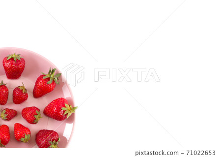 Bright juicy strawberries on a pastel pink. Bright juicy strawberries on a pastel pink. 71022653