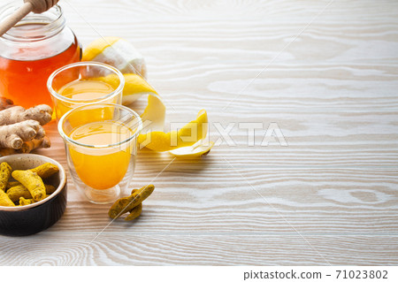 Turmeric lemon honey beverage 71023802