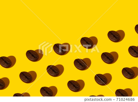 Coffee beans on an orange background. 71024686