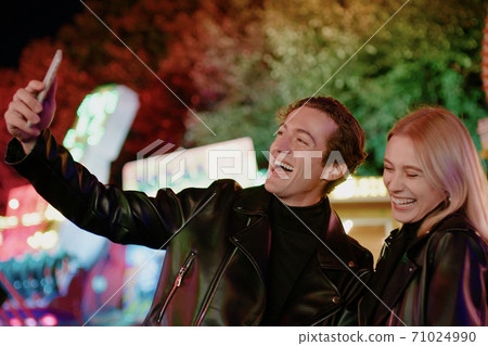 Pretty Smiling Couple Take Selfie on Smartphone Pretty Smiling Couple Take Selfie on Smartphone 71024990