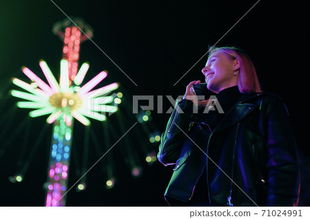 Smiling Girl Speak By Phone Near Carousel Smiling Girl Speak By Phone Near Carousel 71024991