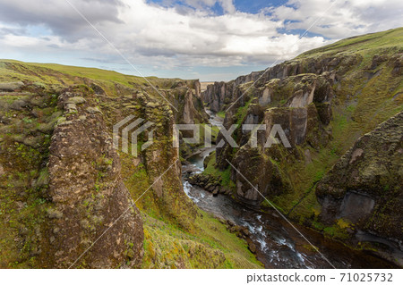 River flowing through Fjarrgljfur canyon in Iceland, Europe. River flowing through Fjarrgljfur canyon in Iceland, Europe. 71025732