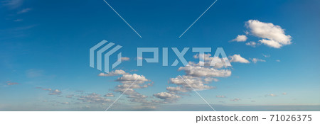 Fantastic clouds against blue sky, panorama Fantastic clouds against blue sky, panorama 71026375