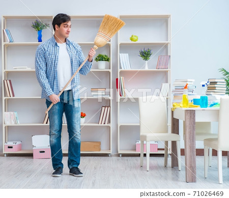 Man doing cleaning at home Man doing cleaning at home 71026469