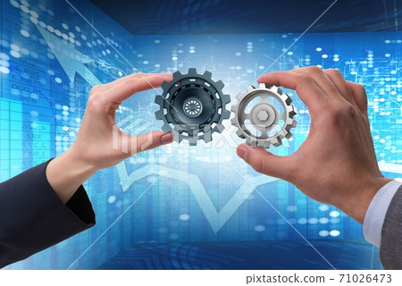 Businessman in teamwork concept with cogwheels 71026473