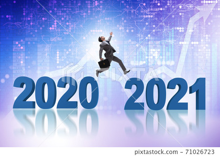 Businessman jumping from the year 2020 to 2021 Businessman jumping from the year 2020 to 2021 71026723