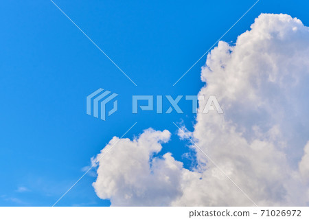 Large air clouds in summer in the sky copy space 71026972