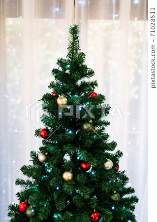 Green fluffy Christmas tree with Christmas balls. Green fluffy Christmas tree with Christmas balls. 71028511