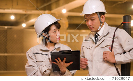 Business woman checking progress at construction site Business woman checking progress at construction site 71029047