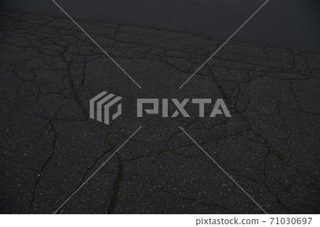 Cracks on the ground Cracks on the asphalt 71030697