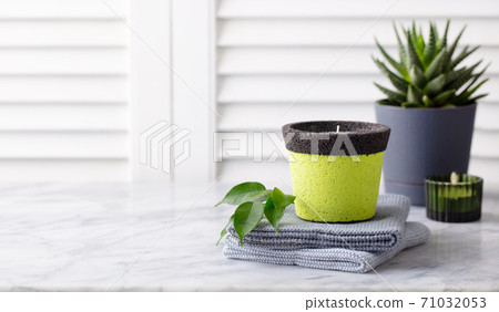 Natural eco home decor, succulent plant, candles, towels on marble table. Wooden white background. Copy space. 71032053