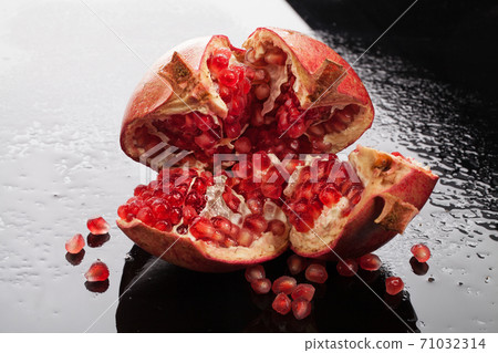 Pomegranate On A Glass Background 71032314