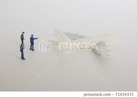 A miniature police officer monitoring a super-large aircraft A miniature police officer monitoring a super-large aircraft 71034335