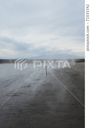 Steam entering the sandy beach - Sand steaming hot spring (Ibusuki city, Kagoshima prefecture) 71035342
