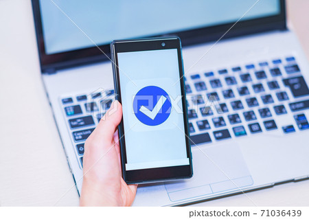 Smartphone authentication verify electronic approval [image of digitization of authentication] 71036439