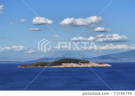 Small island at the sea near Olympiada village in Greece Small island at the sea near Olympiada village in Greece 71036749