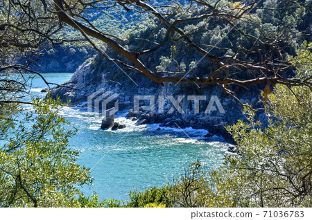 Green mountains and blue sea at Olympiada, Halkidiki, Greece 71036783