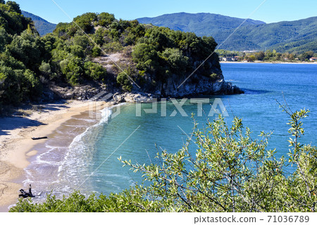 Virgin beach with blue water near Olympiada village, Halkidiki, Greece 71036789