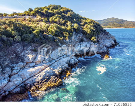 Drone aerial view of sea and rocks in Olympiada, Halkidiki, Greece Drone aerial view of sea and rocks in Olympiada, Halkidiki, Greece 71036835