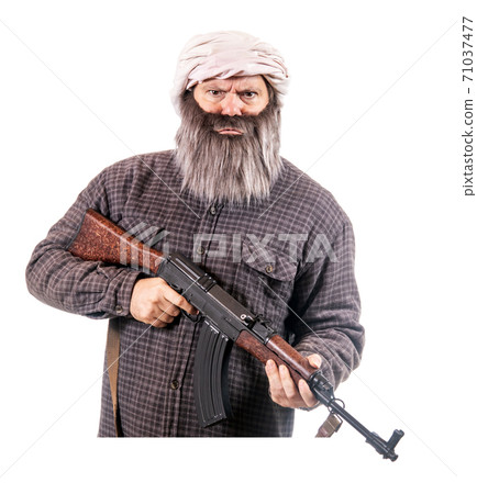 The bearded man armed with kalashnikov isolated on a white background.  71037477