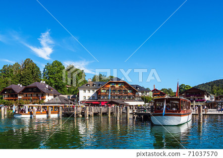 Lake Koenigssee with buildings and ships in the Berchtesgaden Alps, Germany. Lake Koenigssee with buildings and ships in the Berchtesgaden Alps, Germany. 71037570