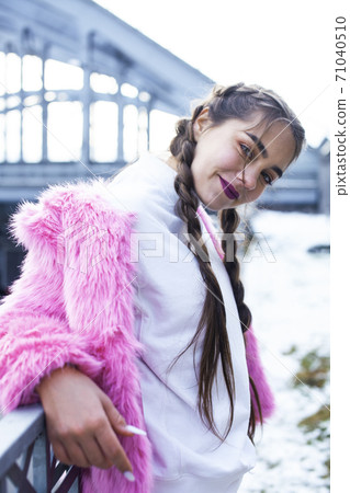 young pretty teenage girl posing cheerful happy smiling wearing street style outside in europe city, lifestyle people concept 71040510