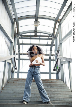 young cute teenage african girl in industrial zone happy smiling having fun, big city lifestyle fashion people young cute teenage african girl in industrial zone happy smiling having fun, big city lifestyle fashion people 71040512