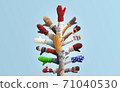 Christmas tree made up of hands with mittens. Winter Christmas concept. 71040530