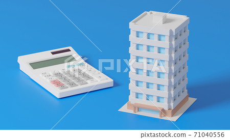 Toy mansion and calculator placed on a flat surface 71040556
