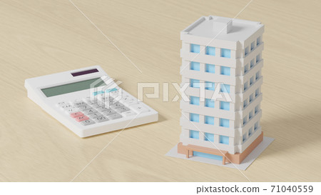 Toy mansion and calculator placed on a flat surface Toy mansion and calculator placed on a flat surface 71040559
