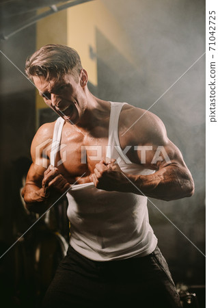 Brutal muscular man showing Muscle body with rage Brutal muscular man showing Muscle body with rage 71042725
