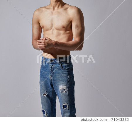 Sexy muscular man's body wearing jeans 71043283