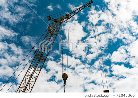 Construction crane against the sky Construction crane against the sky 71043366