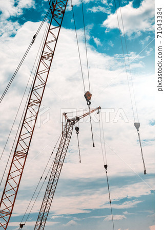 Construction crane against the sky Construction crane against the sky 71043384
