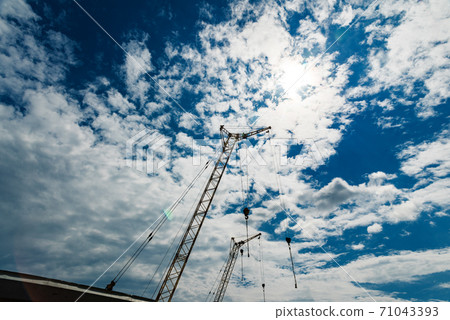 Construction crane against the sky 71043393