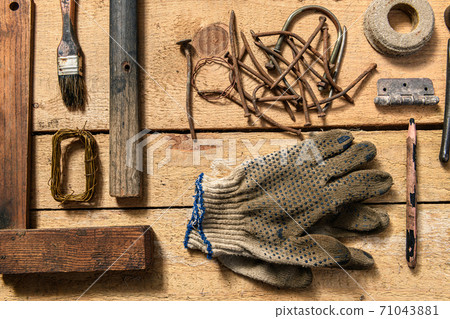 Old vintage household hand tools still life on a wooden background in a DIY and repair concept 71043881
