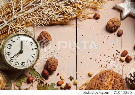 christmas decoration in rustic style and holiday background, still life on wooden backdrop, bread, nuts and other 71043890