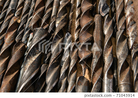 old vintage hand tools - set of drills on a wooden background old vintage hand tools - set of drills on a wooden background 71043914