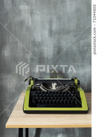 vintage typewriter at wooden table near wall background surface vintage typewriter at wooden table near wall background surface 71044808