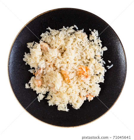 top view of boiled rice with shrimps on plate 71045641