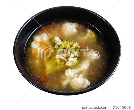 soup with stelline and vegetables in bowl isolated soup with stelline and vegetables in bowl isolated 71045666