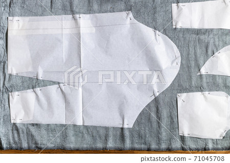 top view of pattern layout of dress on gray fabric top view of pattern layout of dress on gray fabric 71045708