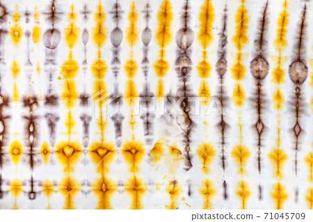 abstract yellow and brown decor in tie-dye batik abstract yellow and brown decor in tie-dye batik 71045709