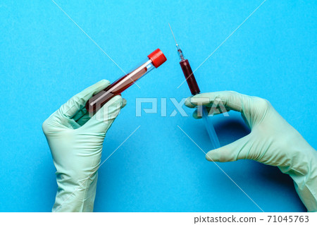 lab technician assistant or doctor holding a blood sample in test tube lab technician assistant or doctor holding a blood sample in test tube 71045763