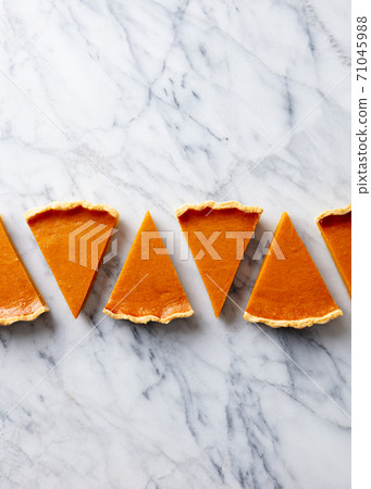 Pumpkin pie, tart pieces for Thanksgiving day. Marble background. Copy space. Top view. 71045988
