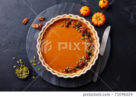 Pumpkin pie on marble board. Grey background. Close up. Top view. 71046024